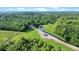 Beautiful aerial view of land featuring private pond and surrounding forest at 13959 Cottageville Hwy, Cottageville, SC 29435