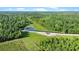 Overhead view of the land featuring the private pond and lush greenery surrounding at 13959 Cottageville Hwy, Cottageville, SC 29435