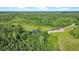 Aerial view of land featuring private pond and surrounding forest at 13959 Cottageville Hwy, Cottageville, SC 29435