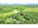 Spacious property featuring a pond, open land, and wooded areas at 13959 Cottageville Hwy, Cottageville, SC 29435
