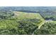 The house is surrounded by lush greenery and expansive open fields at 13959 Cottageville Hwy, Cottageville, SC 29435