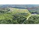 Aerial view of a large tract of land featuring open fields, dense woodlands, and potential for diverse development at 13959 Cottageville Hwy, Cottageville, SC 29435
