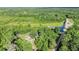 Lush forest setting is captured in an aerial view with main house and detached structures at 13959 Cottageville Hwy, Cottageville, SC 29435