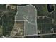This is a detailed aerial view outlining property boundaries and showing land features, enhancing its investment potential at 13959 Cottageville Hwy, Cottageville, SC 29435