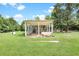 Well-maintained covered patio, perfect for outdoor relaxation and entertainment with ample space at 13959 Cottageville Hwy, Cottageville, SC 29435