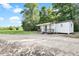 Exterior view of a house with a gravel parking area at 13959 Cottageville Hwy, Cottageville, SC 29435