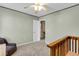 Inviting bedroom featuring neutral paint, comfortable seating area and plush carpet at 146 Education Blvd, Ladson, SC 29456