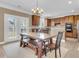 Cozy dining area featuring a wooden dining table with bench seating and stainless steel appliances at 146 Education Blvd, Ladson, SC 29456