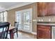 Dining area with french doors, kitchen access, and a view of the backyard at 146 Education Blvd, Ladson, SC 29456