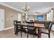 Charming dining area showcasing wooden dining table and chairs adjacent to a comfortable living area at 146 Education Blvd, Ladson, SC 29456
