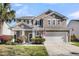 Charming two-story home boasts a two-car garage and well-manicured landscaping at 146 Education Blvd, Ladson, SC 29456