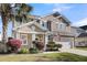 Attractive two-story home featuring an attached two-car garage, front yard, and landscaping at 146 Education Blvd, Ladson, SC 29456