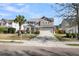 Traditional two-story home featuring a well-kept lawn and a long driveway at 146 Education Blvd, Ladson, SC 29456