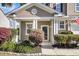 Cozy front porch with white columns and blooming shrubbery enhancing the entrance at 146 Education Blvd, Ladson, SC 29456