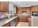Well-lit kitchen with stainless steel appliances, ample counter space, and window at 146 Education Blvd, Ladson, SC 29456