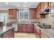 Well-lit kitchen with wood cabinets, stainless steel appliances, and durable countertops at 146 Education Blvd, Ladson, SC 29456