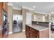 Gourmet kitchen featuring a stainless steel refrigerator and microwave, wood cabinets, and ample counter space at 146 Education Blvd, Ladson, SC 29456