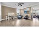 Open-concept living room features great light, seating area, and view into additional room at 146 Education Blvd, Ladson, SC 29456