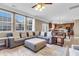 Open floor plan with an oversized sectional, a ceiling fan, and an adjacent dining area at 146 Education Blvd, Ladson, SC 29456