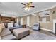 Spacious open-concept living area offering a fireplace, ceiling fan, and adjoining kitchen and dining spaces at 146 Education Blvd, Ladson, SC 29456