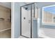 Bathroom with a shower with glass door and window, plus a walk-in closet at 146 Education Blvd, Ladson, SC 29456