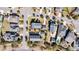 An aerial view of a residential area showcasing well-maintained homes, lush landscaping, and quiet neighborhood streets at 1525 Harriman St, Mount Pleasant, SC 29466