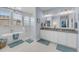 A luxurious bathroom with a standalone tub, glass shower, and double vanity sinks at 1525 Harriman St, Mount Pleasant, SC 29466