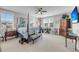 This airy bedroom features a four-poster bed, multiple windows, and traditional-style furnishings at 1525 Harriman St, Mount Pleasant, SC 29466