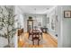 Formal dining room featuring hardwood floors, classic furnishings, and a view of the outdoor greenery at 1525 Harriman St, Mount Pleasant, SC 29466