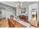 Elegant dining room featuring hardwood floors, classic furnishings, and a view of the stairway at 1525 Harriman St, Mount Pleasant, SC 29466