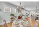 Inviting dining room with hardwood floors, chandelier, and view into the kitchen area at 1525 Harriman St, Mount Pleasant, SC 29466