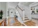 Inviting entryway with hardwood floors, staircase, and views into other rooms at 1525 Harriman St, Mount Pleasant, SC 29466