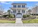 Charming two-story home with a welcoming front porch and beautifully landscaped yard at 1525 Harriman St, Mount Pleasant, SC 29466