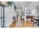 Inviting foyer features hardwood floors, elegant staircase, wainscoting, and open access to the living spaces at 1525 Harriman St, Mount Pleasant, SC 29466