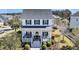 Charming two-story home featuring a welcoming front porch with rocking chairs and beautifully landscaped yard at 1525 Harriman St, Mount Pleasant, SC 29466