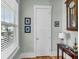 Bright hallway with natural light, stylish table lamp, and traditional decorations enhancing a cozy ambiance at 1525 Harriman St, Mount Pleasant, SC 29466