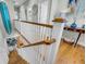 Hallway with white banister, hardwood floors, and stylish decor leads to open living spaces at 1525 Harriman St, Mount Pleasant, SC 29466
