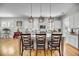 An open kitchen design with a large island and granite countertops complemented by modern appliances and pendant lighting at 1525 Harriman St, Mount Pleasant, SC 29466
