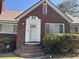 Charming brick home featuring an arched brick staircase leading to a classic white front door at 161 Gordon Street, Charleston, SC 29403