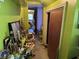 Cluttered hallway with a collection of items and a door leading to another room at 161 Gordon Street, Charleston, SC 29403