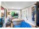 Cozy living room featuring neutral walls and comfortable seating, filled with natural light and stylish decor at 171 Broad St, Charleston, SC 29401