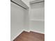 Walk in closet with wood-look floors and built-in shelving at 209 Pointer Dr, Summerville, SC 29485