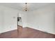 Neutral dining room with wood floors and modern chandelier adjacent to the kitchen at 209 Pointer Dr, Summerville, SC 29485