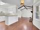 Open-concept living room and kitchen area featuring wood floors, white walls, and vaulted ceiling with exposed wood beams at 209 Pointer Dr, Summerville, SC 29485