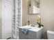 Bathroom featuring a gray vanity with storage, built-in shelving, and a shower/tub combination at 2120 Thornlee Dr, North Charleston, SC 29405