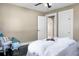 Cozy bedroom featuring sleek dark floors, neutral walls, and a ceiling fan for added comfort at 2120 Thornlee Dr, North Charleston, SC 29405