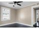 Bedroom featuring dark floors, a ceiling fan, and a window for natural light at 2120 Thornlee Dr, North Charleston, SC 29405