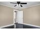 Bedroom showcasing sleek dark floors, neutral walls, and a doorway leading to another room at 2120 Thornlee Dr, North Charleston, SC 29405