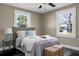 Comfortable bedroom with natural light, neutral décor, and ceiling fan at 2120 Thornlee Dr, North Charleston, SC 29405