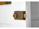 Close up of an old-fashioned metal door lock on a white door at 2120 Thornlee Dr, North Charleston, SC 29405